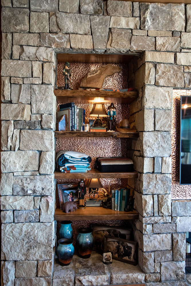 Custom built in shelves with stonework